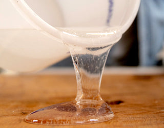 Pouring mixed resin on wood