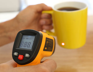 Cup of hot coffee with a temperature gauge showing it's heat value. 